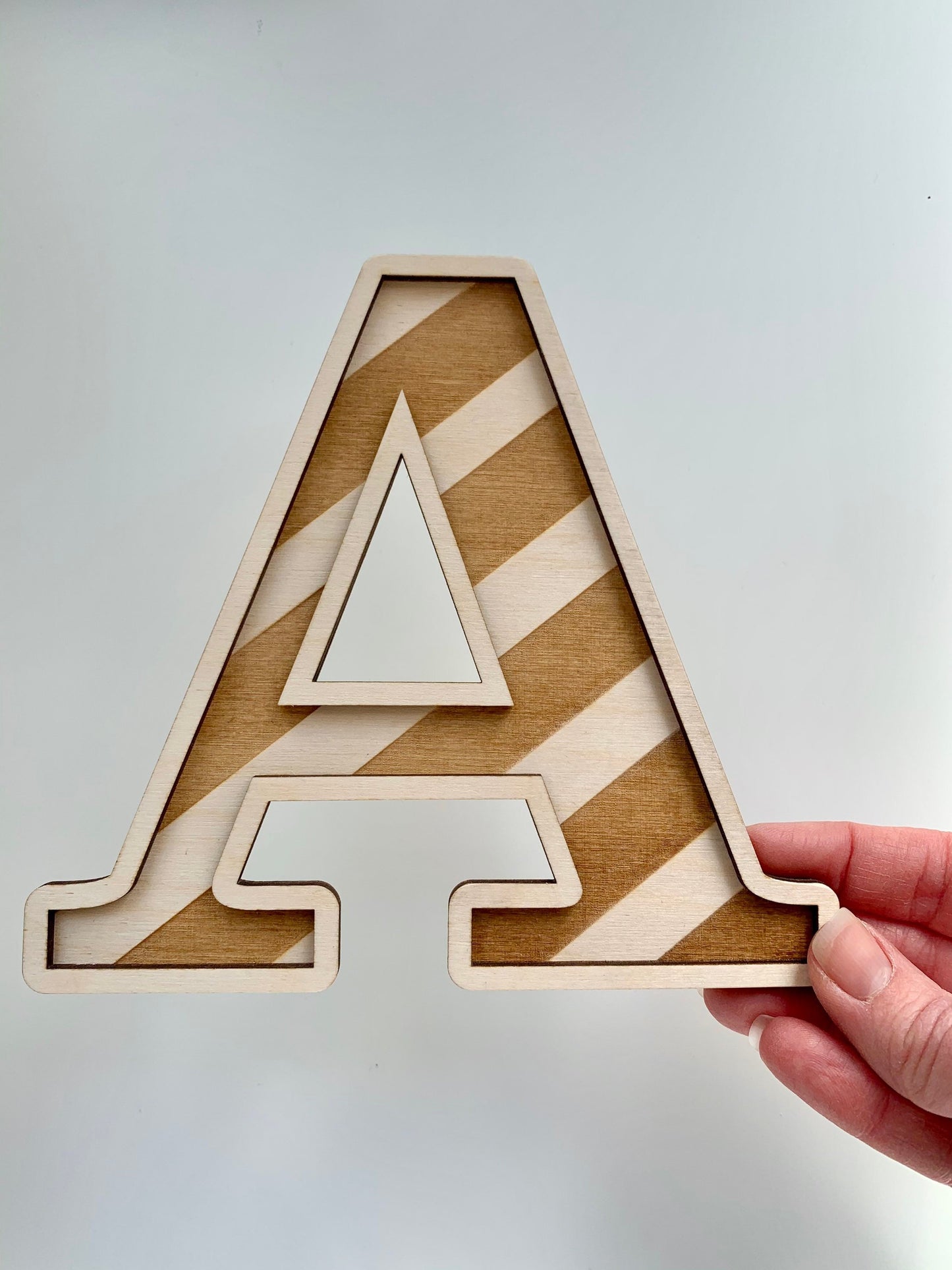 Large striped wooden letter