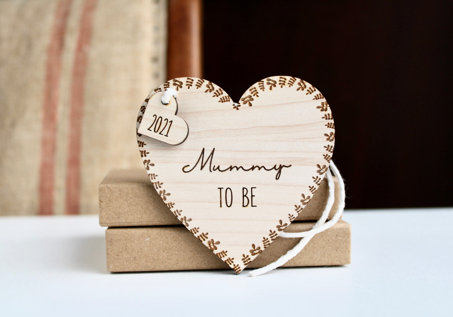Heart shaped decoration made from maple veneer and engraved with mummy to be