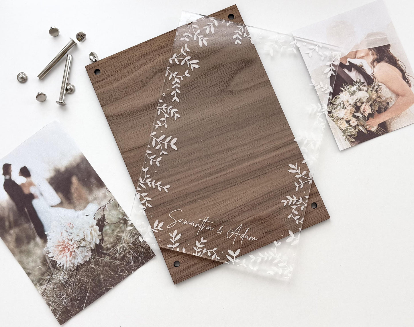 A flat-lay of a personalized wooden photo plaque with a clear acrylic leaf border overlay, accompanied by mounting hardware and sample wedding photos on a white background.