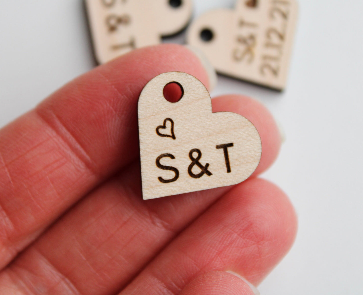 Wooden wedding favour tags engraved with initials and heart