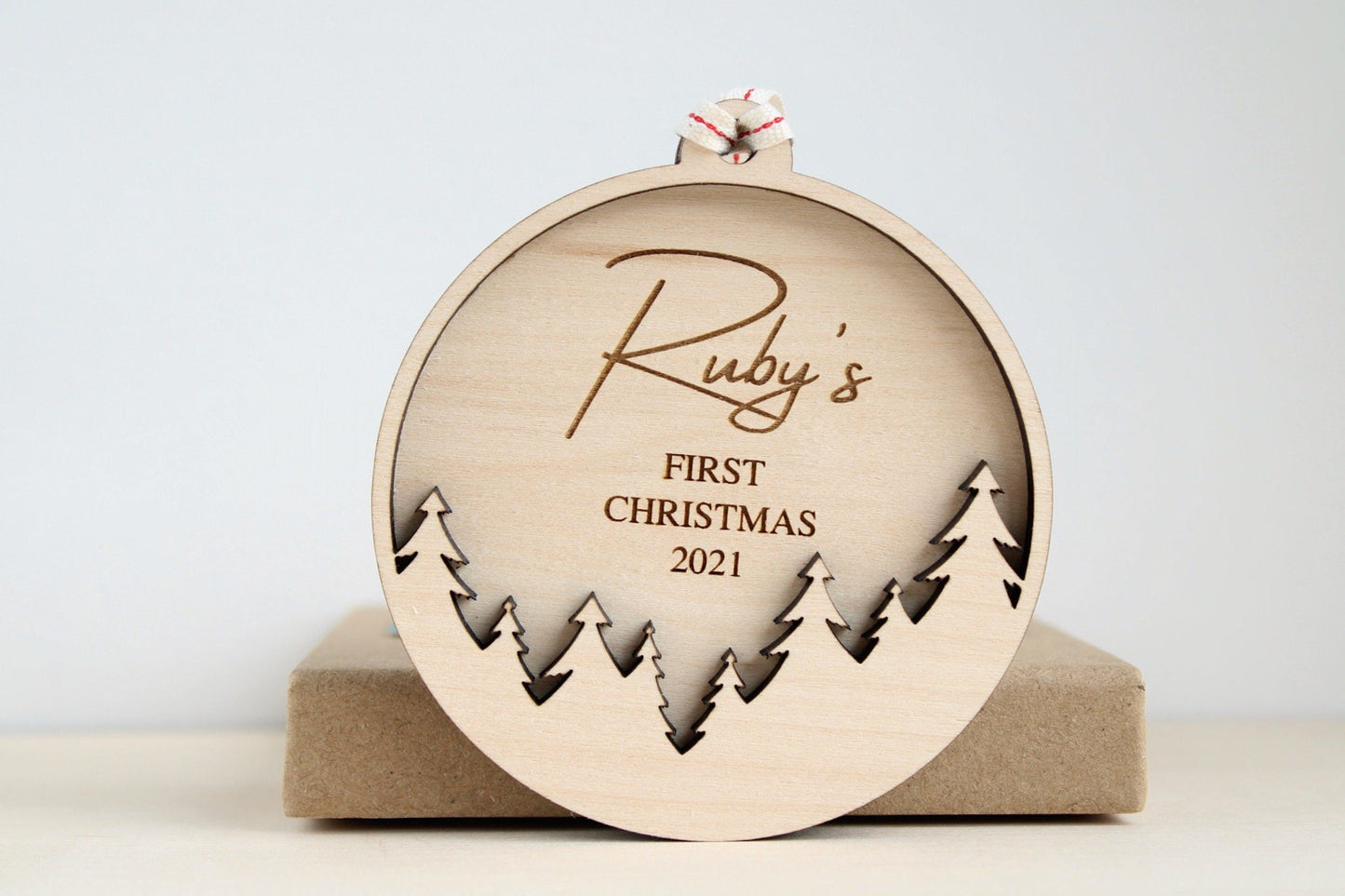 First Christmas bauble with tree design