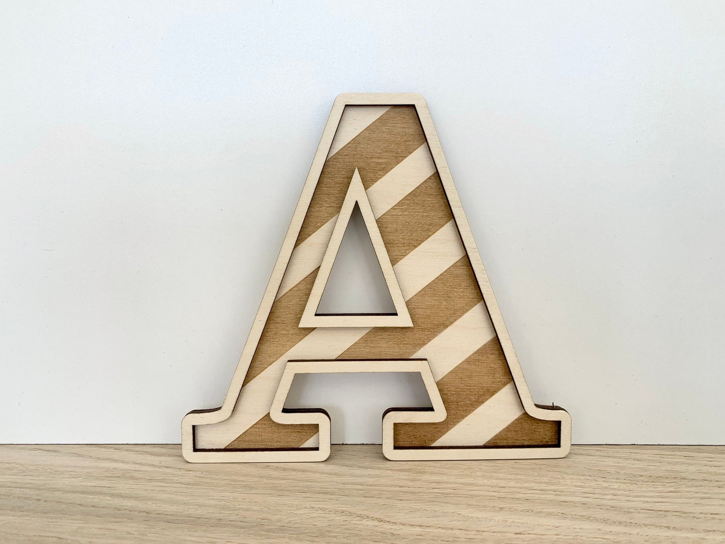 Large striped wooden letter